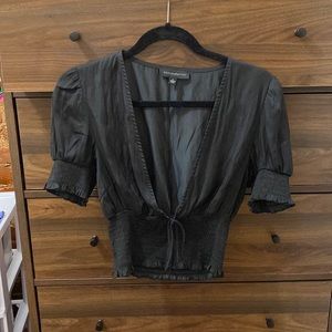 Dolls Kill | “Dance & Marvel” black deep v blouse w/ tie and puff sleeve detail